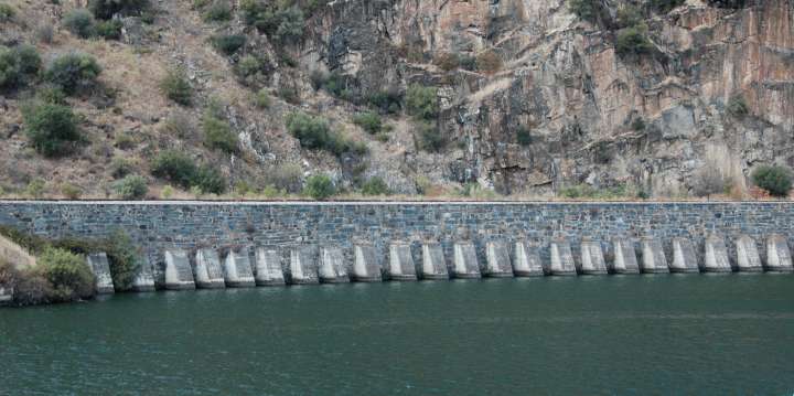 Stone railway embankment along the Douro River, Portugal