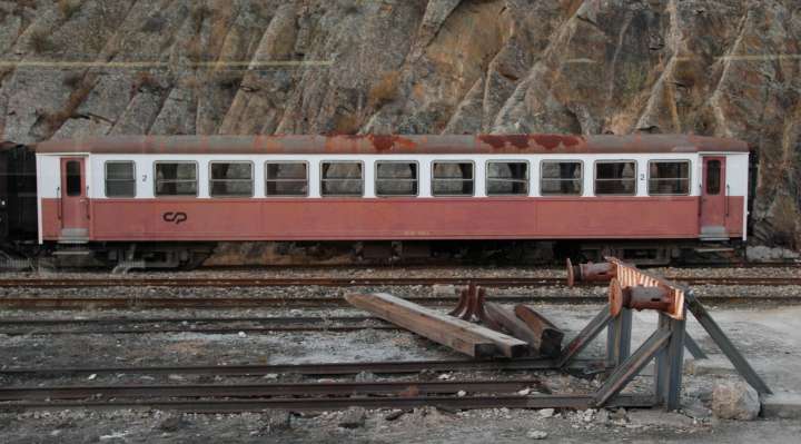 Passenger coach awaiting preservation  at a station near Regua, Portugal