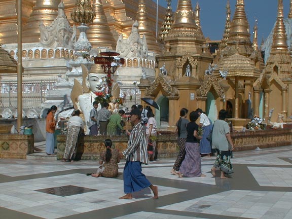 Worshippers before the white Buddha