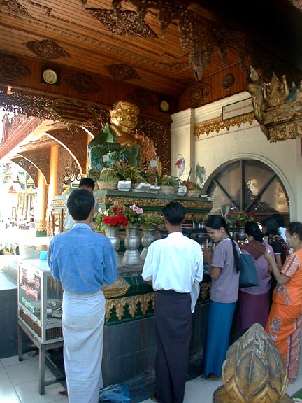 Worshippers before an altar to an ogress