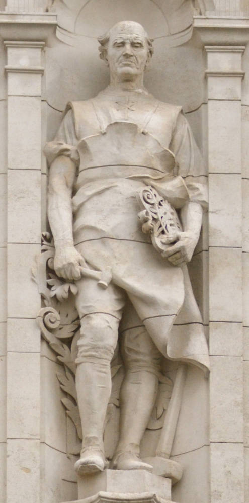 Keystone with  man with curly hair surrounded” by flowers